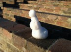 tiny little snowman contemplates existence